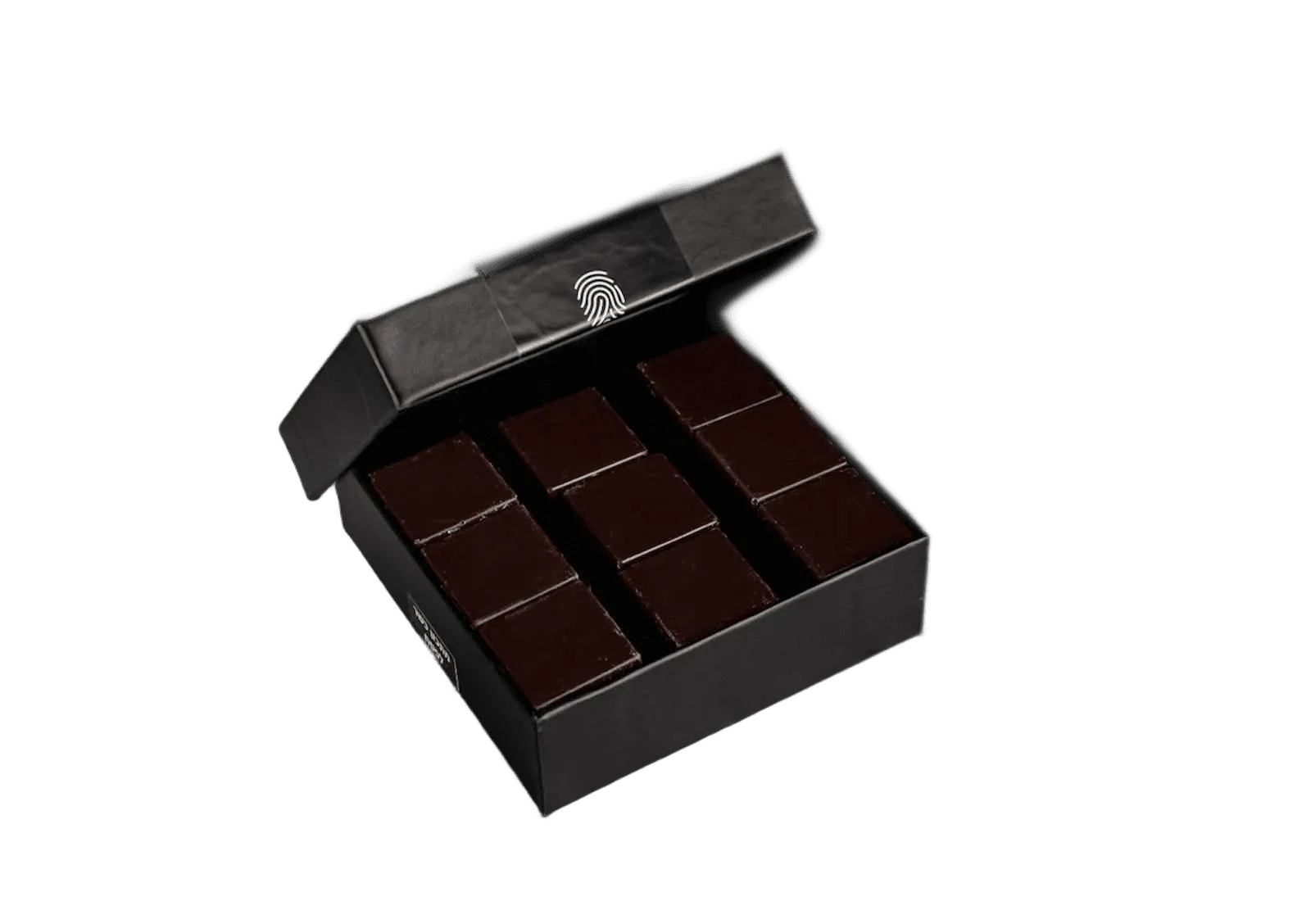 An open black box of chocolate squares